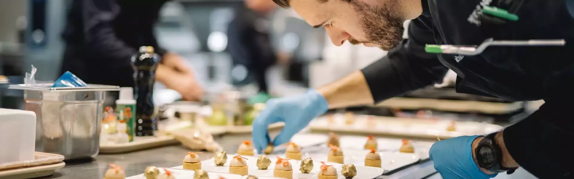 People setting food on tray
