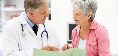 Doctor giving patient advice on what can be done to prevent osteoporosis