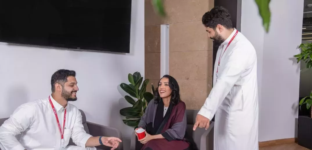 three colleagues talking