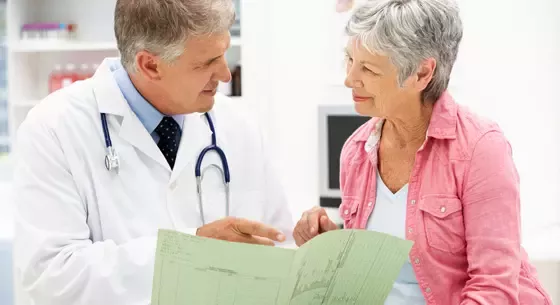 Doctor giving patient advice on what can be done to prevent osteoporosis